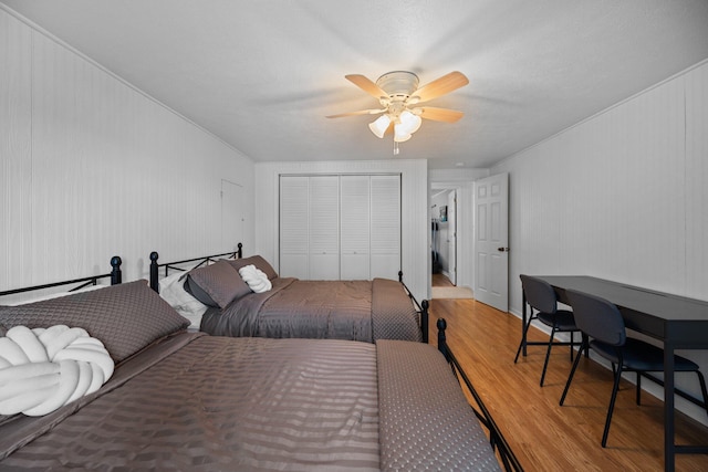 5012 Green Acre Dr, Frederic, MI 49733 - bedroom featuring wood finished floors, a closet, and ceiling fan