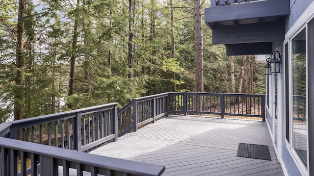 5012 Green Acre Dr, Frederic, MI 49733 - wooden deck featuring a view of trees