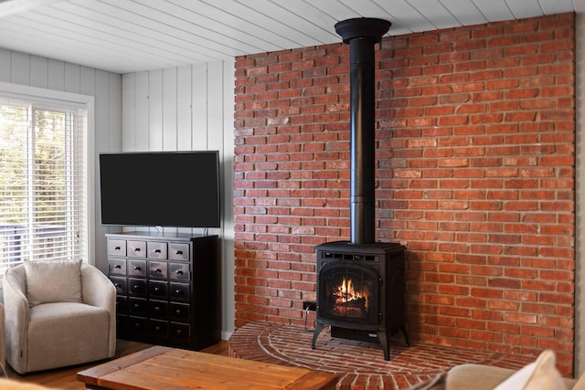 5012 Green Acre Dr, Frederic, MI 49733 - living area with a wood stove and wood finished floors