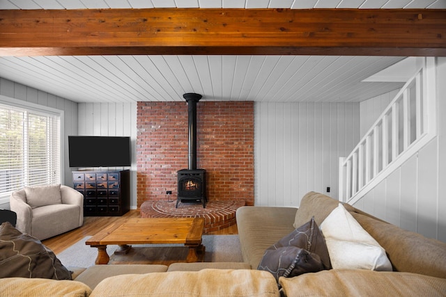 5012 Green Acre Dr, Frederic, MI 49733 - living room featuring wood finished floors, a wood stove, and wood walls