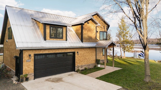 835 M-88, Bellaire, MI 49615 - view of front of house with a garage, a front lawn, and concrete driveway
