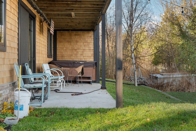 835 M-88, Bellaire, MI 49615 - view of green lawn featuring a hot tub and a patio