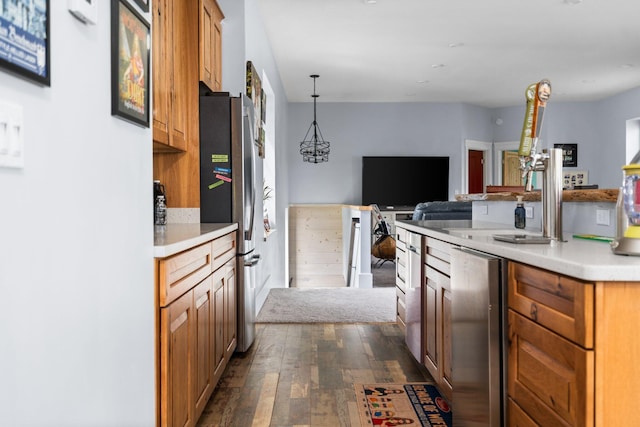 835 M-88, Bellaire, MI 49615 - kitchen featuring freestanding refrigerator, open floor plan, dark wood-style flooring, light countertops, and brown cabinetry