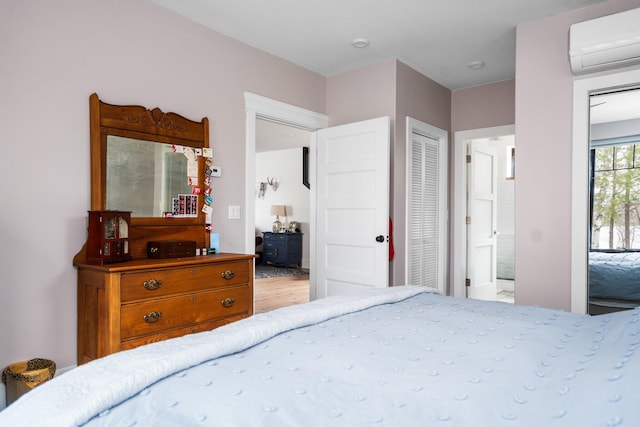 835 M-88, Bellaire, MI 49615 - bedroom featuring a wall unit AC and wood finished floors