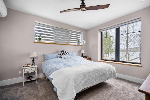 835 M-88, Bellaire, MI 49615 - carpeted bedroom featuring an AC wall unit, baseboards, and a ceiling fan