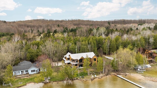 835 M-88, Bellaire, MI 49615 - view from above of property with a nearby body of water and a heavily wooded area