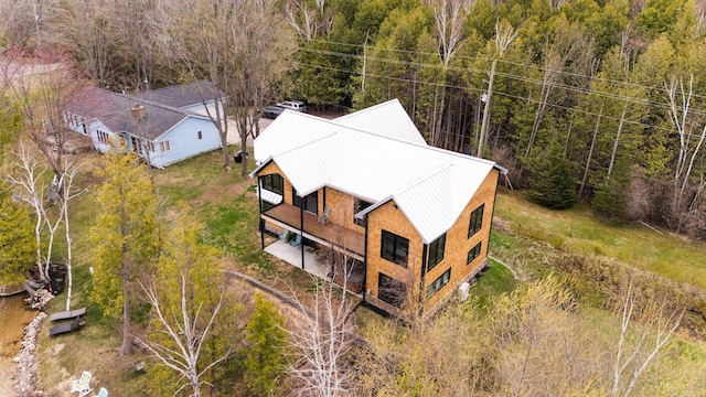 835 M-88, Bellaire, MI 49615 - aerial view of property and surrounding area with a forest