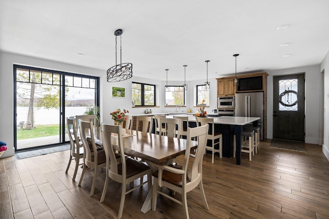 835 M-88, Bellaire, MI 49615 - dining space with hardwood / wood-style flooring and a water view