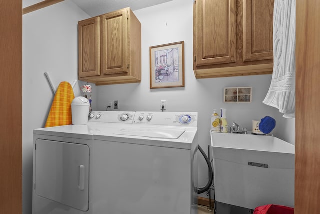 120 Beechwood Ave, Houghton Lake, MI 48629 - washroom with cabinet space, washing machine and dryer, and a sink