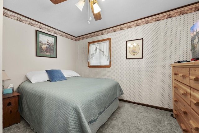 carpeted bedroom with baseboards and a ceiling fan