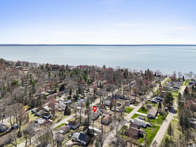 birds eye view of property featuring a water view and a residential view