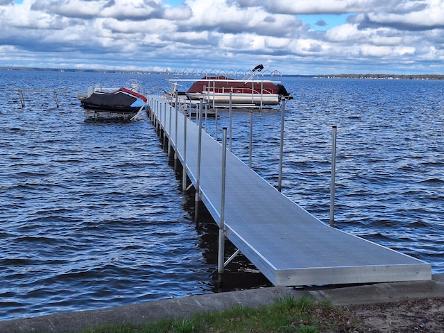 dock area featuring a water view and boat lift