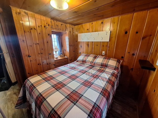 bedroom with wood walls