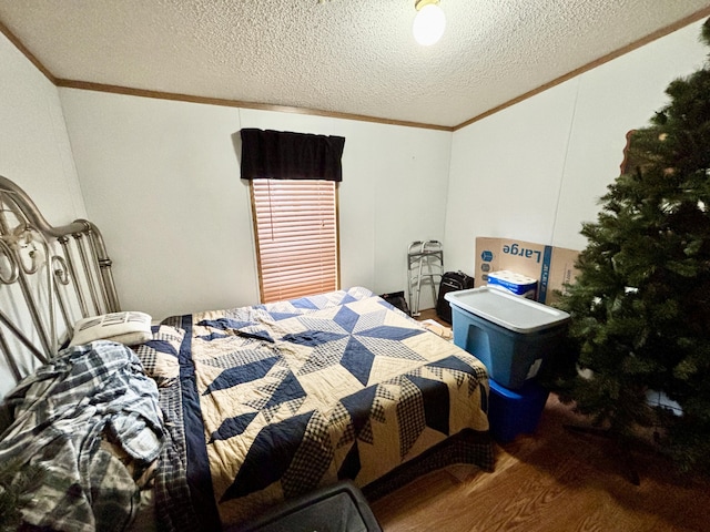 3313 Pleasant View Dr, Lewiston, MI 49756 - bedroom with crown molding, a textured ceiling, and wood finished floors