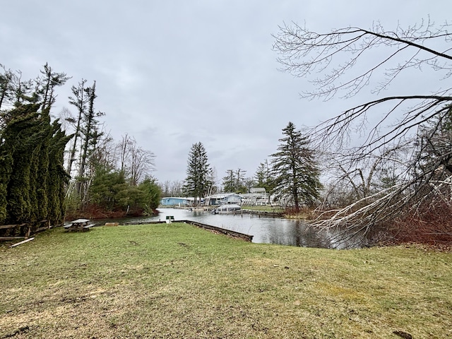 3313 Pleasant View Dr, Lewiston, MI 49756 - view of green lawn with a water view