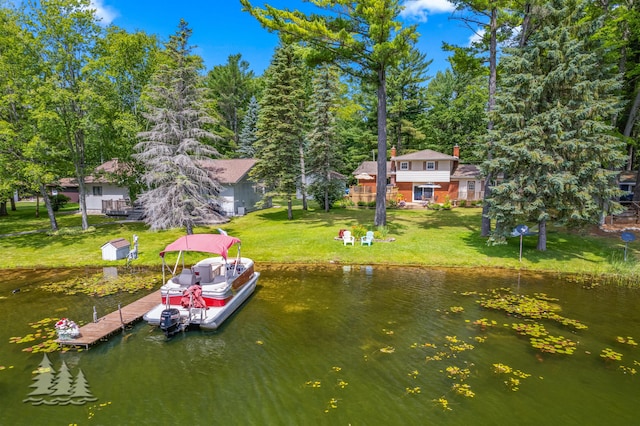 3897 S Mielke Way Rd, Lewiston, MI 49756 - dock area featuring a water view and a yard