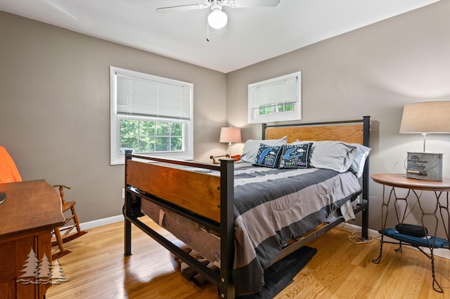 3897 S Mielke Way Rd, Lewiston, MI 49756 - bedroom featuring baseboards, ceiling fan, and wood finished floors