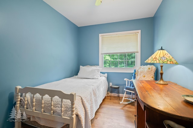 3897 S Mielke Way Rd, Lewiston, MI 49756 - bedroom featuring baseboards, ceiling fan, and wood finished floors