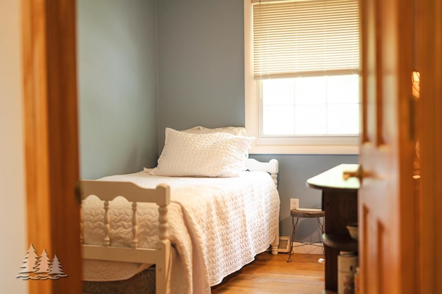 3897 S Mielke Way Rd, Lewiston, MI 49756 - bedroom with wood finished floors