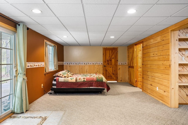 1350 Pine Point Dr, Lewiston, MI 49756 - carpeted bedroom with wooden walls, recessed lighting, and a wainscoted wall