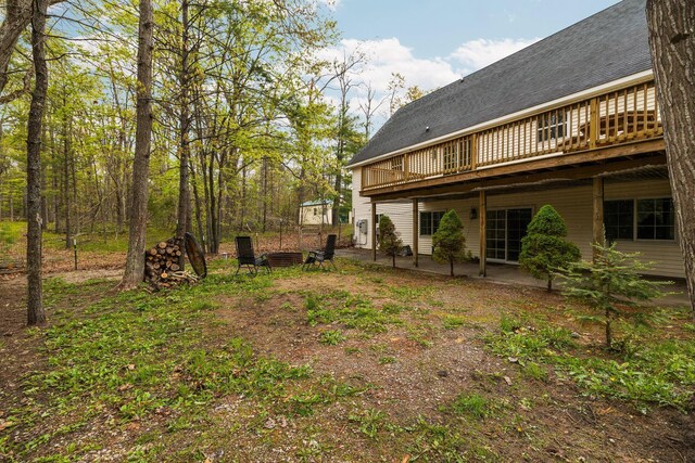 1350 Pine Point Dr, Lewiston, MI 49756 - view of yard featuring a patio area and a wooden deck