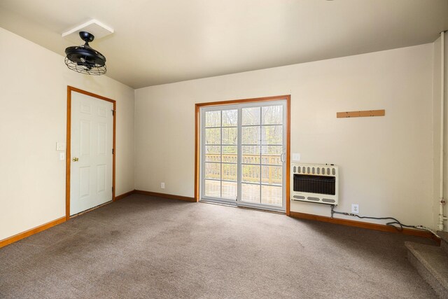 1350 Pine Point Dr, Lewiston, MI 49756 - empty room featuring heating unit, carpet, and baseboards