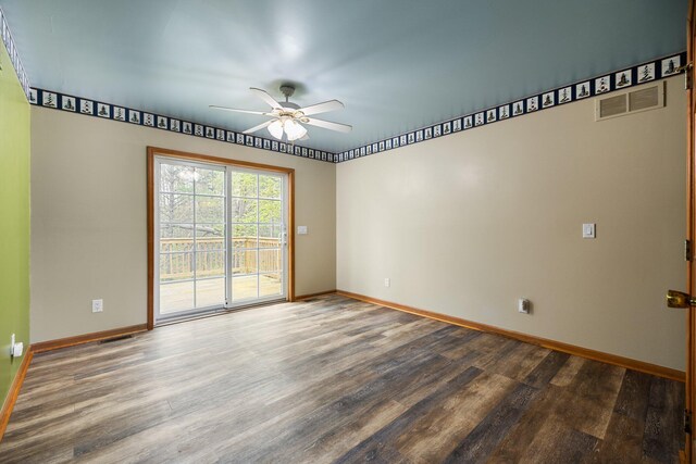 1350 Pine Point Dr, Lewiston, MI 49756 - spare room featuring ceiling fan, wood finished floors, and baseboards