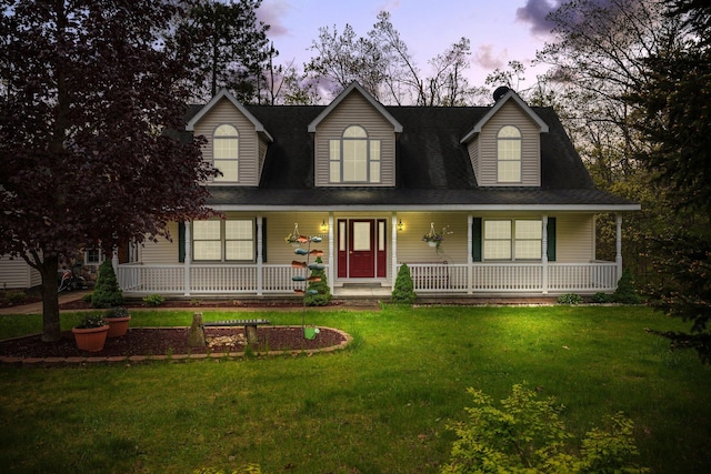 1350 Pine Point Dr, Lewiston, MI 49756 - new england style home featuring a porch and a front yard