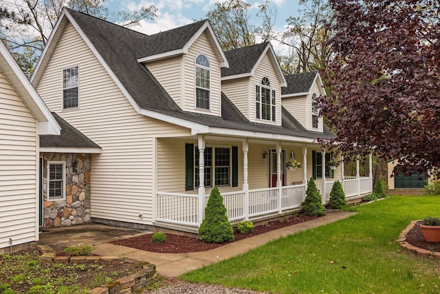 1350 Pine Point Dr, Lewiston, MI 49756 - view of front of home featuring a porch, a front yard, and roof with shingles