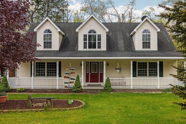 1350 Pine Point Dr, Lewiston, MI 49756 - cape cod house featuring covered porch and a front lawn
