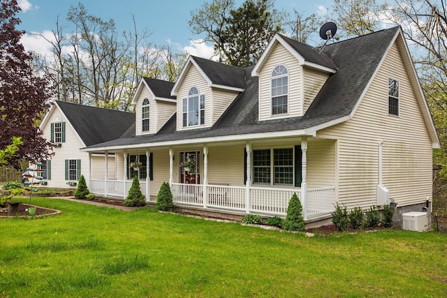 1350 Pine Point Dr, Lewiston, MI 49756 - cape cod house with covered porch, a front lawn, and roof with shingles
