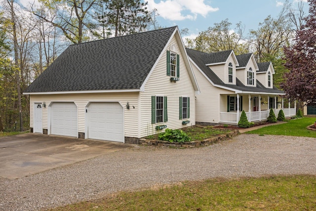 1350 Pine Point Dr, Lewiston, MI 49756 - view of front facade featuring a porch, roof with shingles, driveway, and a garage
