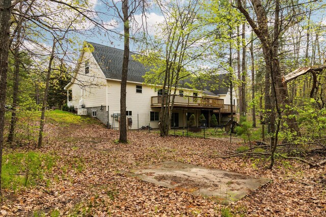 1350 Pine Point Dr, Lewiston, MI 49756 - back of property with a deck and a shingled roof