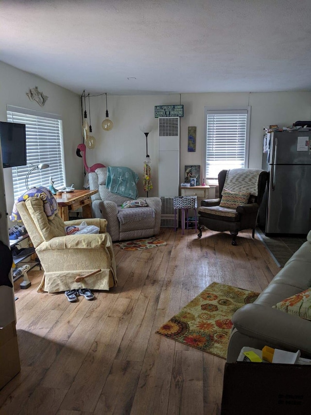 11052 W Higgins Lake Dr, Roscommon, MI 48653 - living area featuring hardwood / wood-style flooring