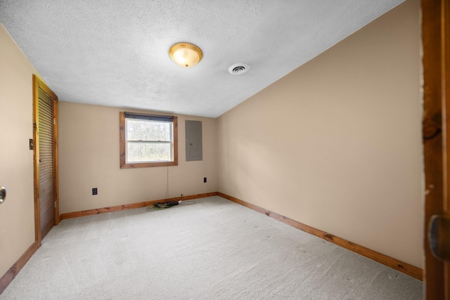 4441 Judy Ave, Lewiston, MI 49756 - unfurnished bedroom with electric panel, carpet flooring, a textured ceiling, baseboards, and a closet