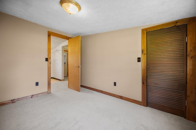 4441 Judy Ave, Lewiston, MI 49756 - unfurnished room with light colored carpet, a textured ceiling, and baseboards