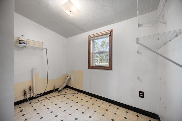 4441 Judy Ave, Lewiston, MI 49756 - spare room featuring vaulted ceiling, baseboards, and a textured ceiling