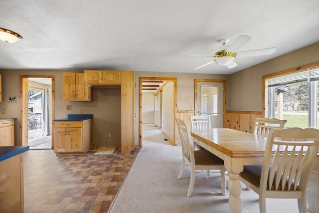 4441 Judy Ave, Lewiston, MI 49756 - dining room with ceiling fan and a wainscoted wall