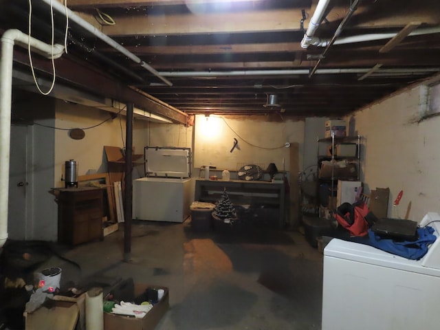 unfinished basement with washer / dryer