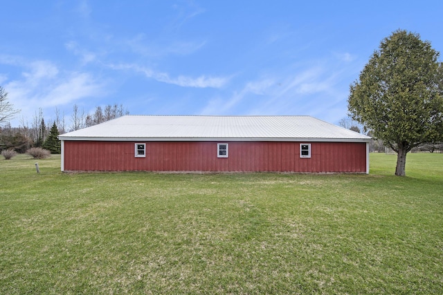 view of pole building with a yard