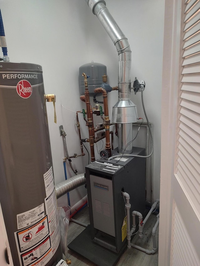 10232 E Airport Rd, Saint Helen, MI 48656 - utility room with gas water heater