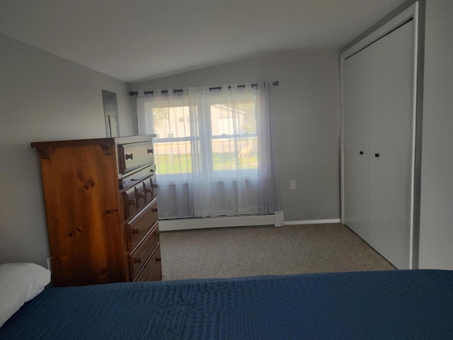10232 E Airport Rd, Saint Helen, MI 48656 - unfurnished bedroom featuring carpet floors, baseboards, lofted ceiling, a baseboard radiator, and a closet