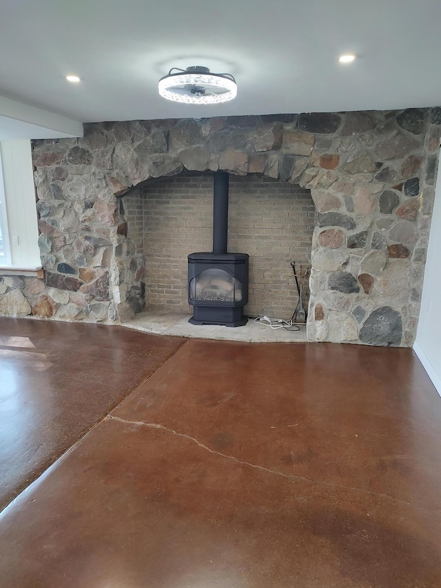 10232 E Airport Rd, Saint Helen, MI 48656 - interior details with finished concrete floors and a wood stove