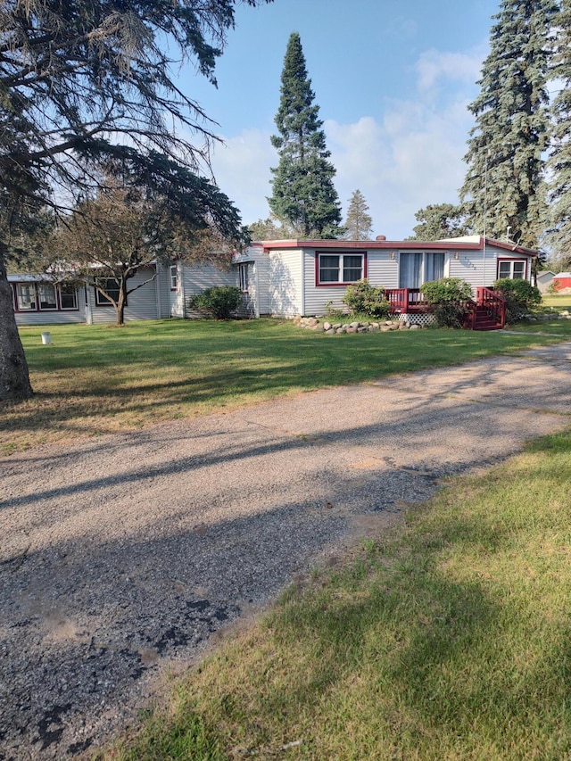10232 E Airport Rd, Saint Helen, MI 48656 - view of front of house featuring a deck and a front yard
