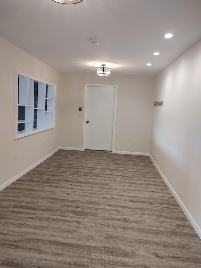 10232 E Airport Rd, Saint Helen, MI 48656 - empty room with baseboards, recessed lighting, and wood finished floors