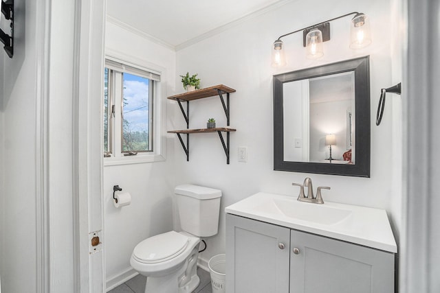bathroom with baseboards, ornamental molding, toilet, and vanity