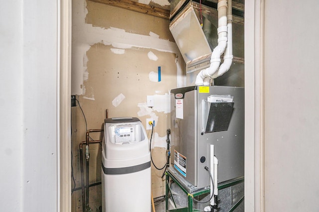 utility room featuring heating unit
