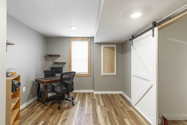 2211 N Kerby Rd, Owosso, MI 48867 - office space featuring light wood finished floors, a barn door, and baseboards
