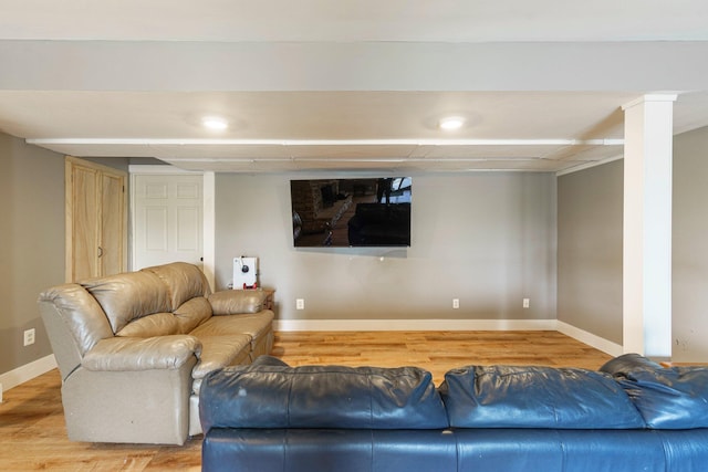 2211 N Kerby Rd, Owosso, MI 48867 - living area featuring baseboards and light wood-style floors