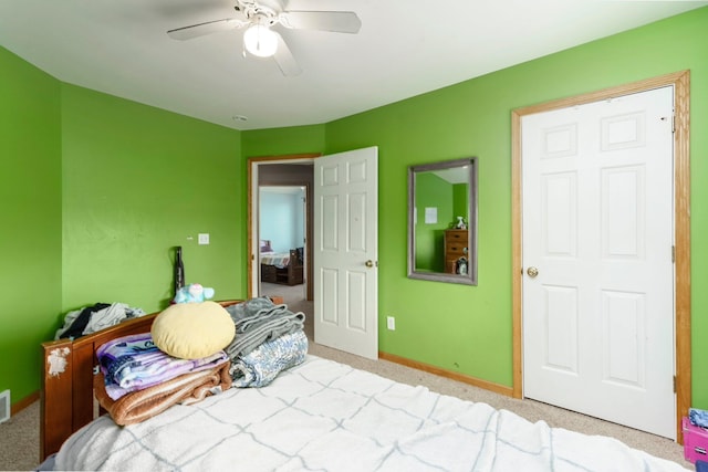 2211 N Kerby Rd, Owosso, MI 48867 - bedroom featuring light carpet, baseboards, and ceiling fan